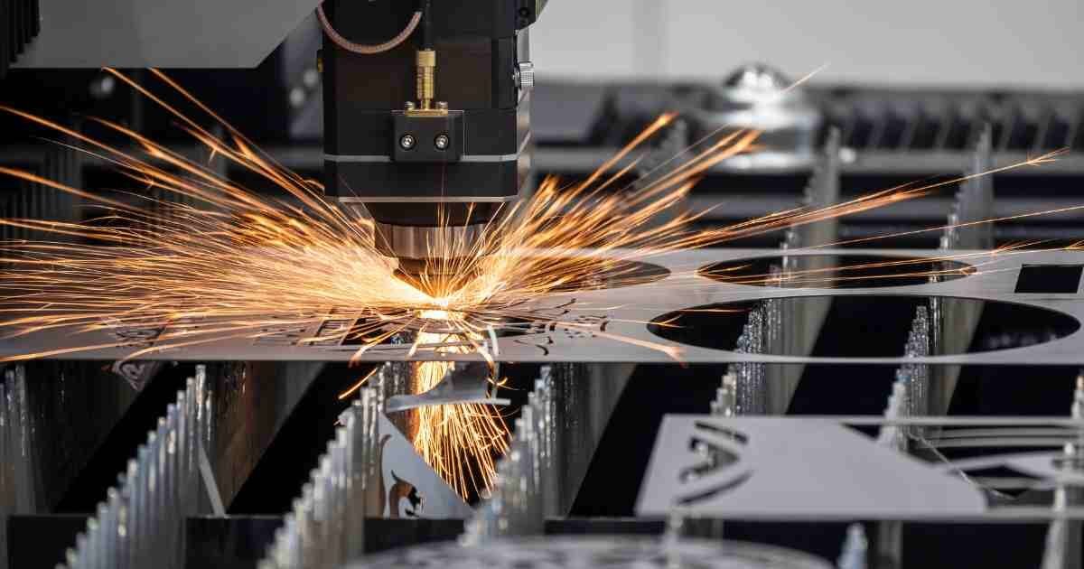 High-precision laser cutting machine creating intricate designs on thin metal sheets.